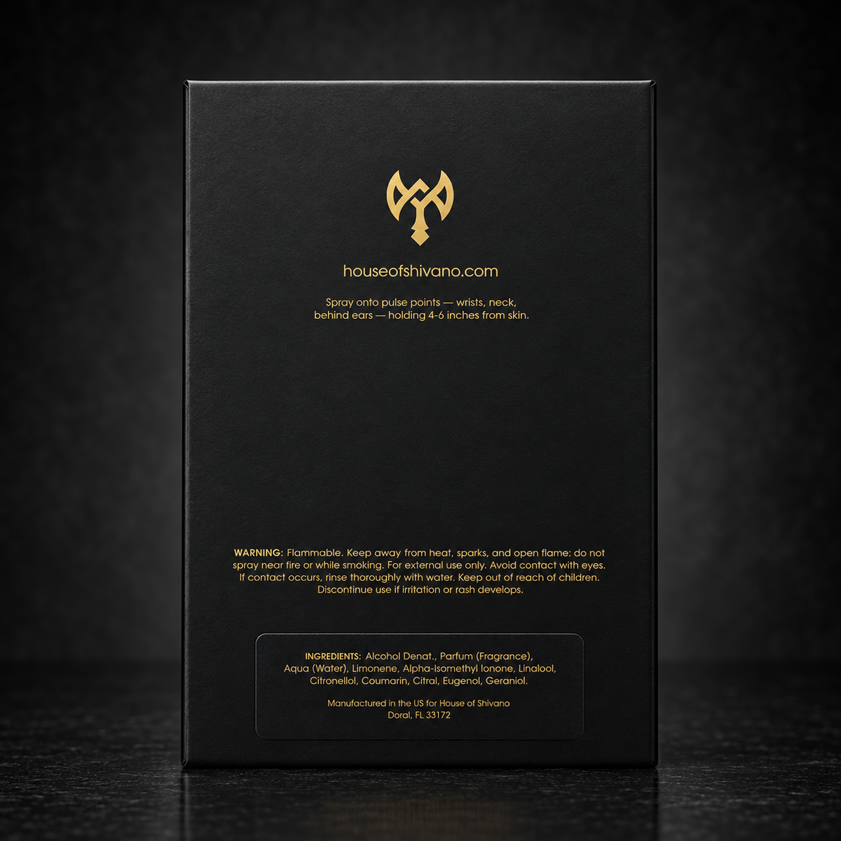 The back of a tall black product box with gold text and logo, photographed against a dark black background. The visible brand text reads houseofshivano.