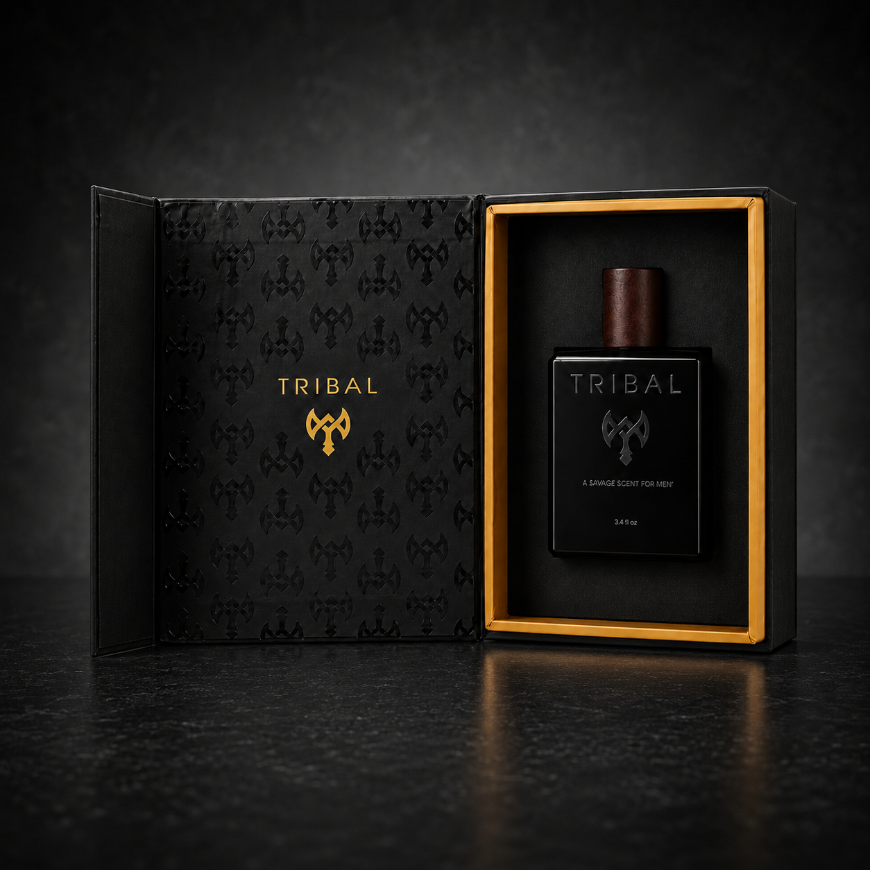 Tribal cologne set with a black rectangular bottle and dark brown cap displayed inside an open black gift box with gold trim and gold logo, on a dark reflective surface.